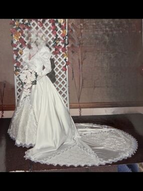 Elegant Ivory Long-Sleeve Wedding Gown with Cathedral Train